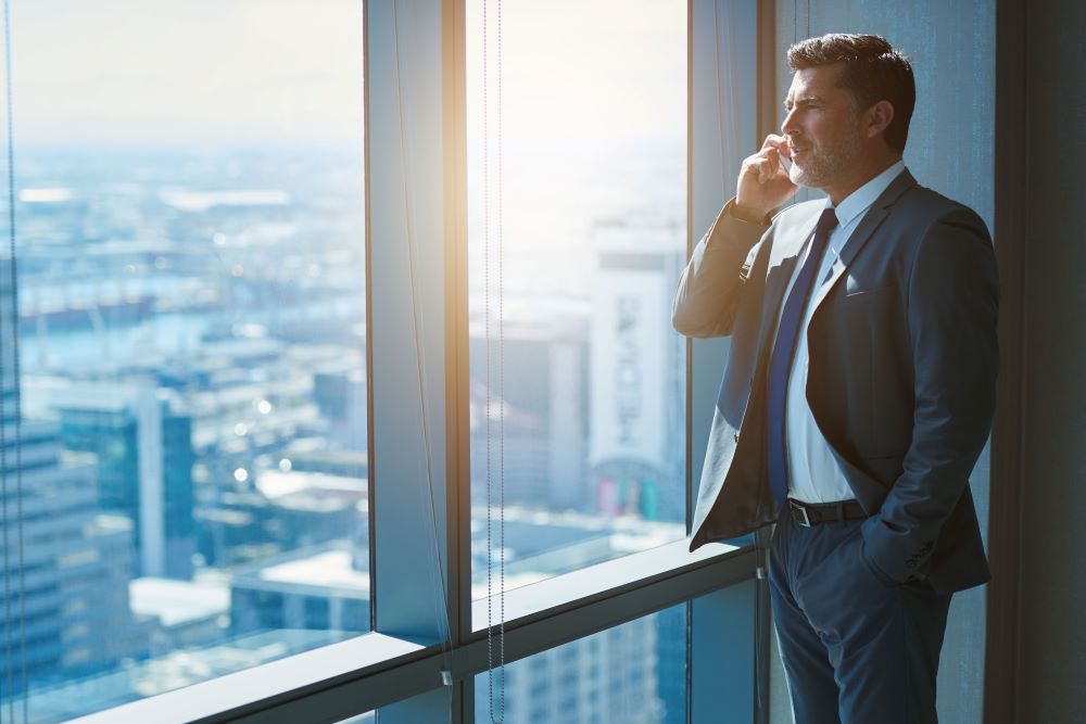 Mature business CEO talking on phone